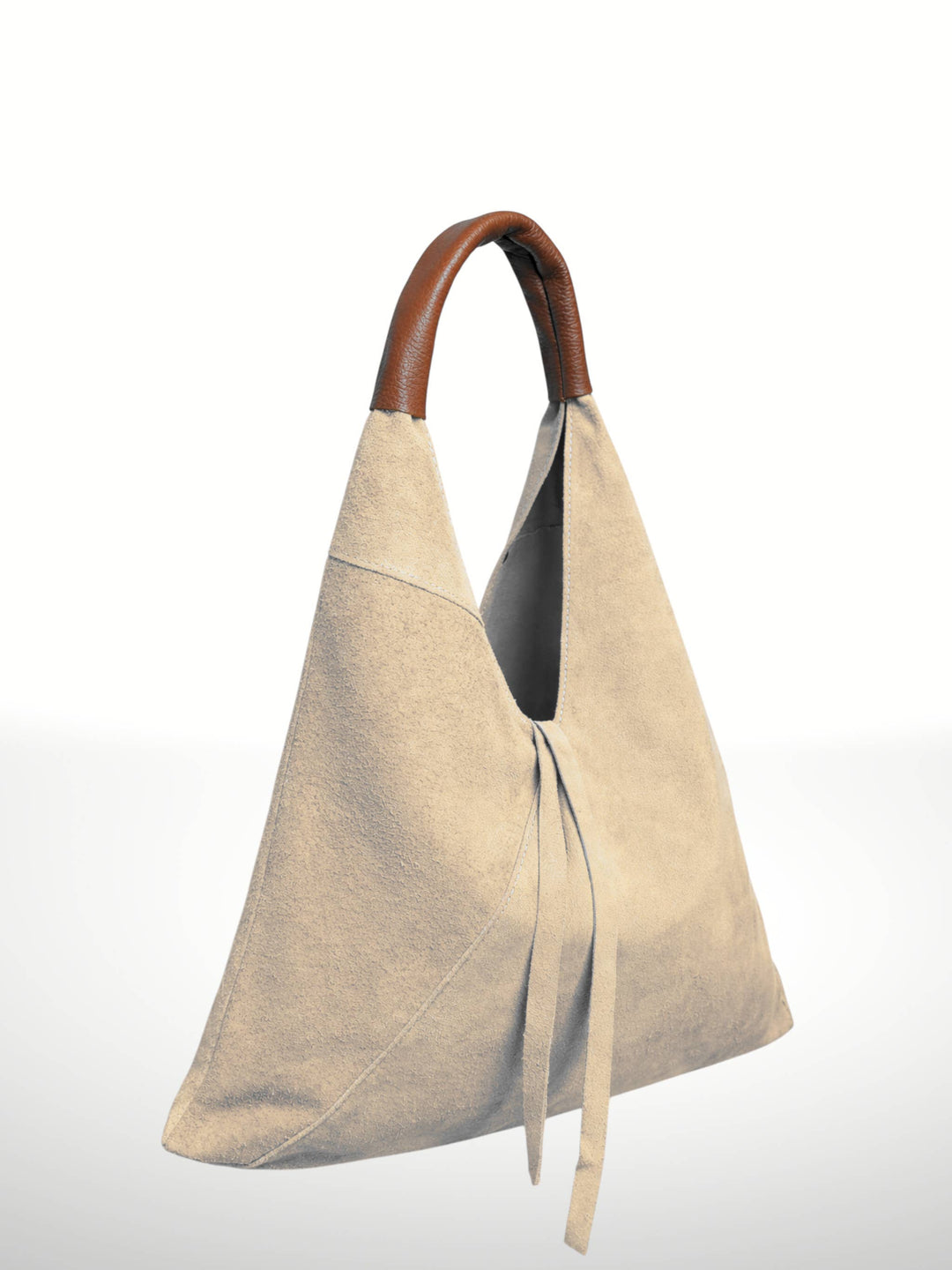 A minimalist beige suede hobo-style shoulder bag with a brown leather top handle, shown against a clean white background.