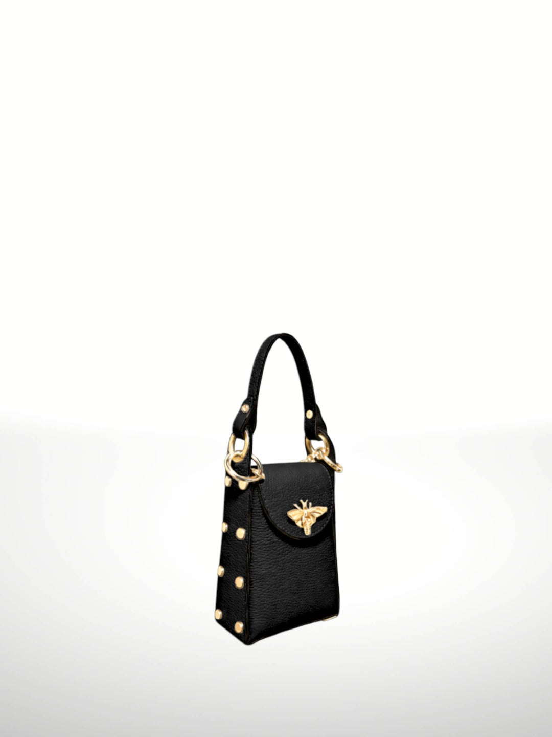 A black textured leather handbag with gold-tone hardware, featuring a top handle, gold studs, and a prominent gold winged emblem on the front flap, set against a plain white background.
