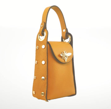 Yellow handbag with gold accents on a white background