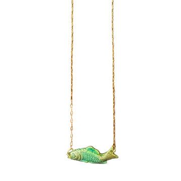 Gold chain necklace with a green fish pendant on a white background