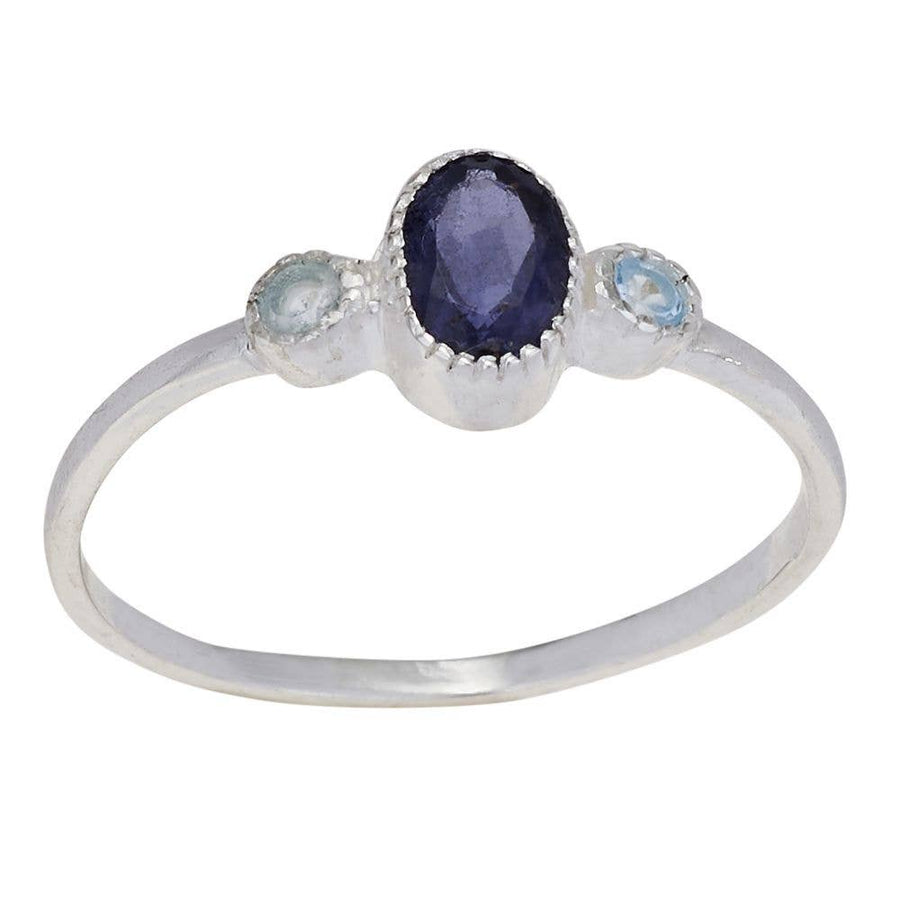 Silver ring with a central purple gemstone flanked by two smaller blue gemstones on a white background