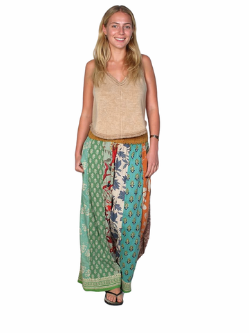 Woman wearing a colorful patterned skirt on a white background