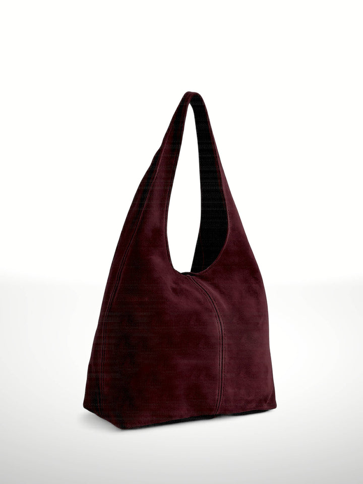 Maroon handbag on a white background