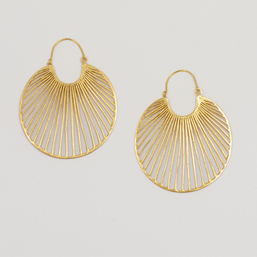 Gold hoop earrings on a light gray background