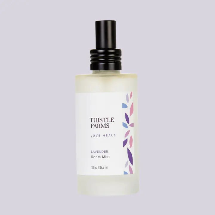 Thistle Farms lavender room mist bottle on a light gray background