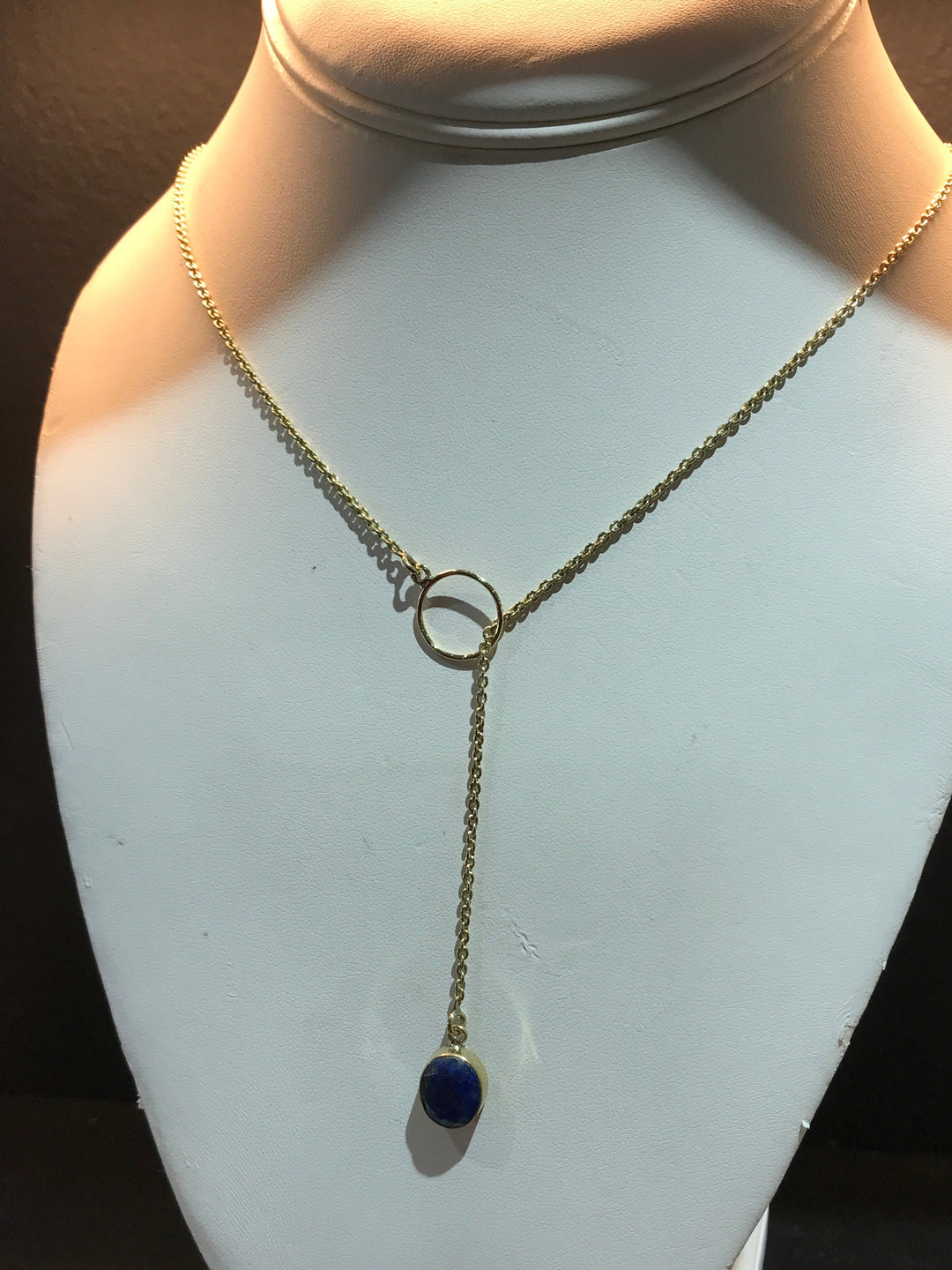 Brass lariat necklace with cut lapis stone