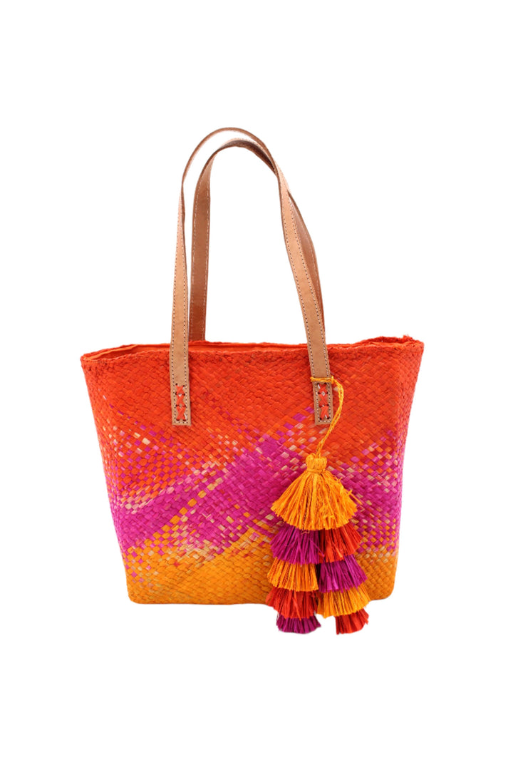 Orange and pink tote bag with a tassel on a white background