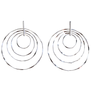 Silver hoop earrings with multiple concentric circles on a white background