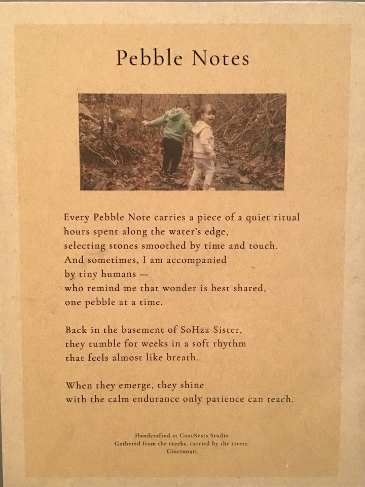 Pebble Notes book with a photograph of two people in a forest on a brown background