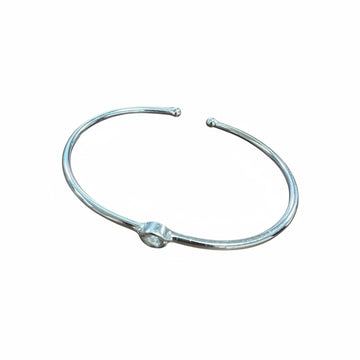 Silver metal neck ring on a white background