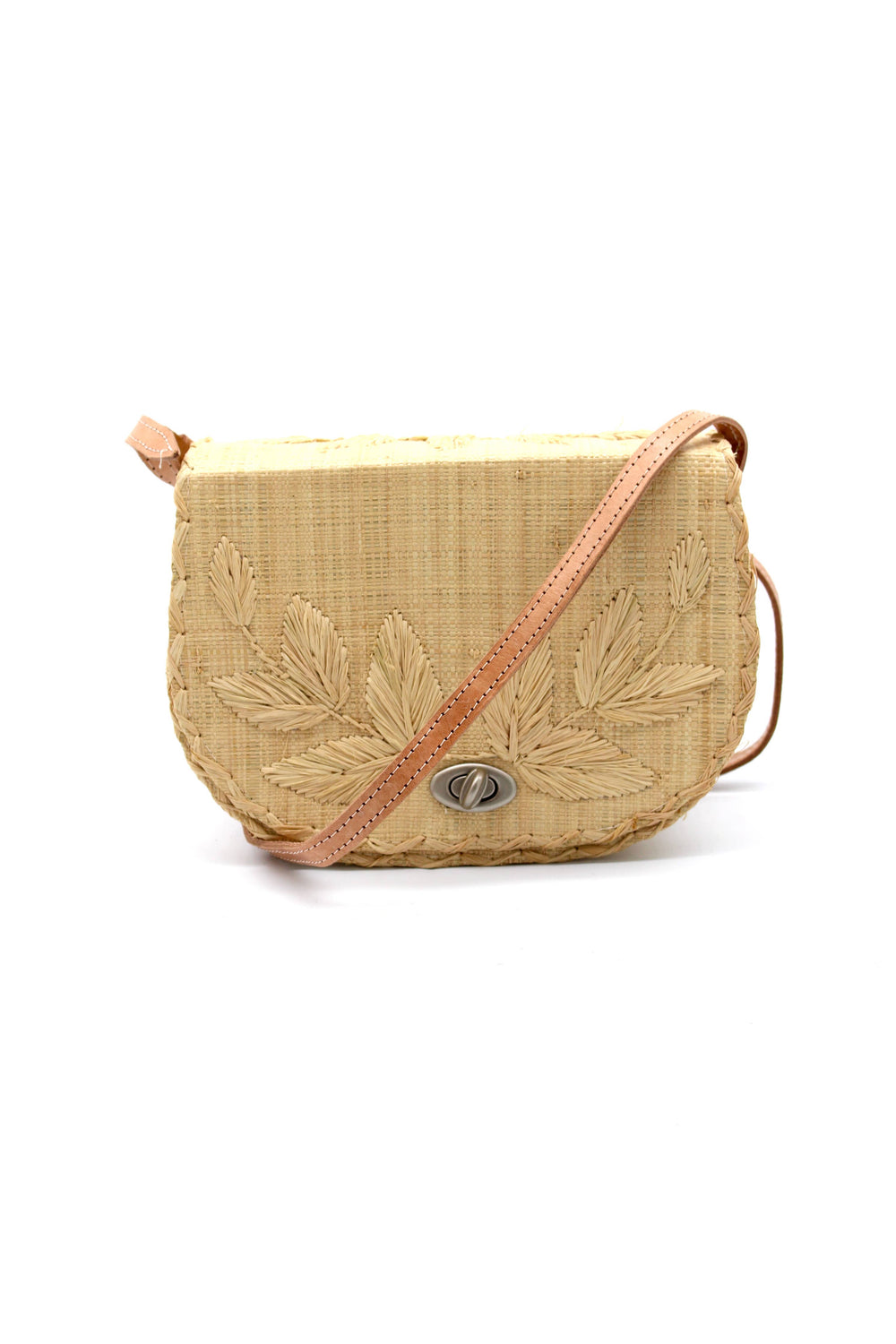 Beige woven handbag with leaf patterns on a white background