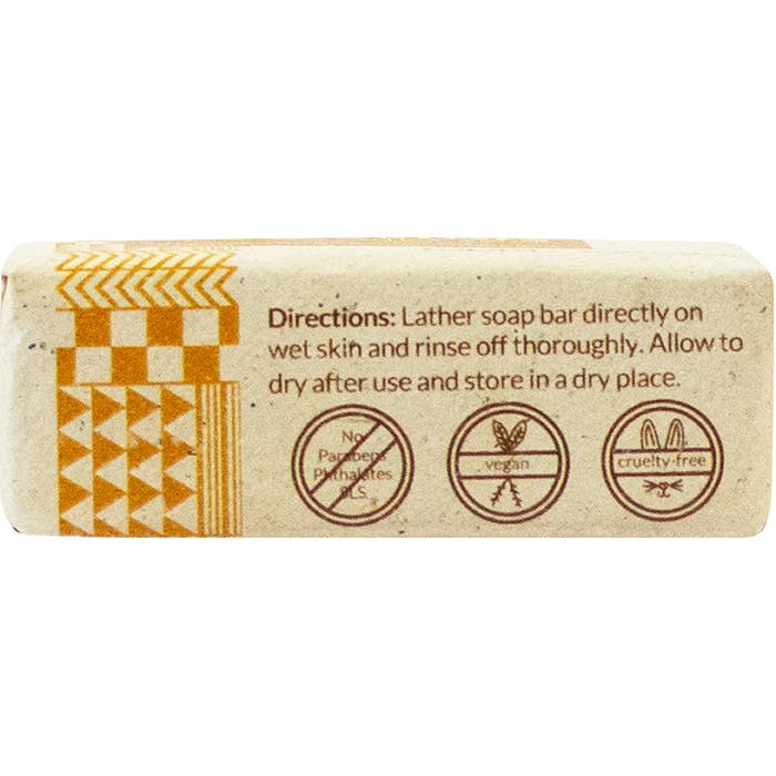 Bar of soap with packaging featuring directions and ethical icons on a white background