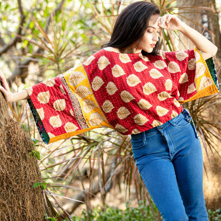 Woman wearing a colorful patterned shawl outdoors