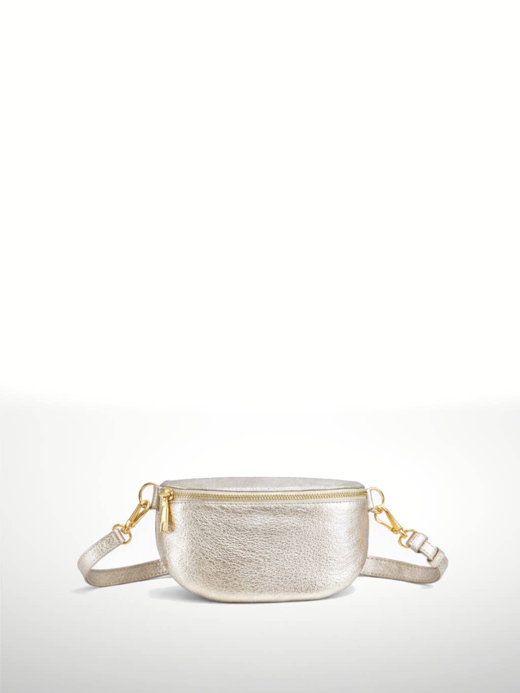 A small metallic silver leather crossbody bag with a gold zipper and gold hardware, shown against a plain white background.