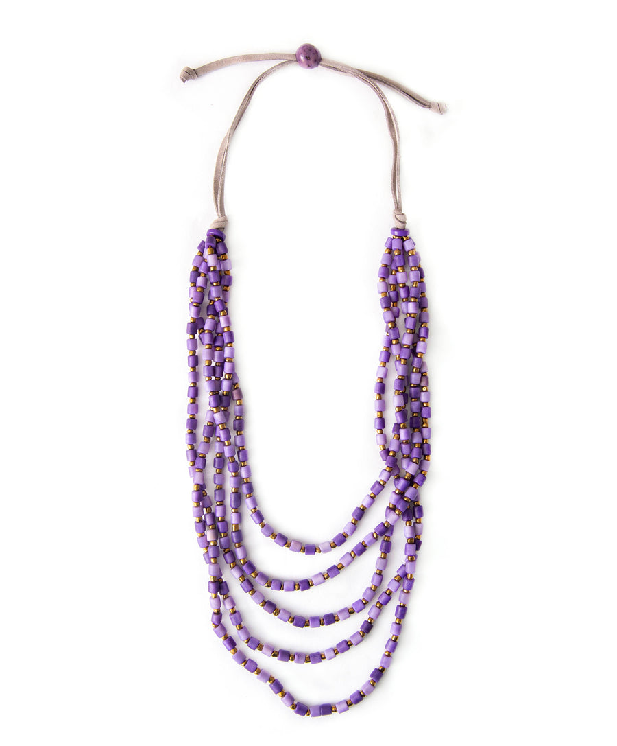 Multistrand beaded necklace with purple beads on a white background