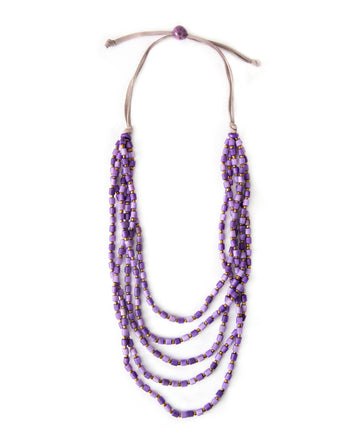 Multistrand beaded necklace with purple beads on a white background