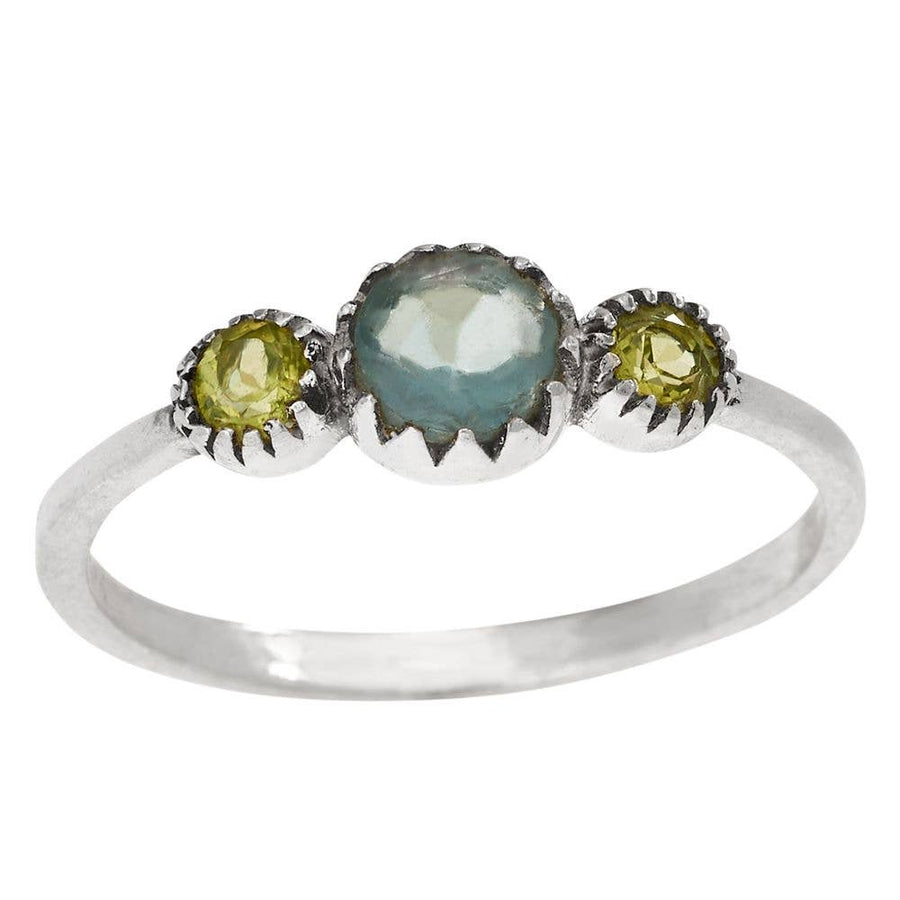 Silver ring with three gemstones on a white background
