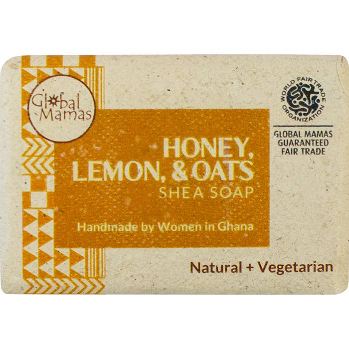 Shea soap bar with 'Global Mamas' branding and 'Honey, Lemon & Oats' flavor on a white background.