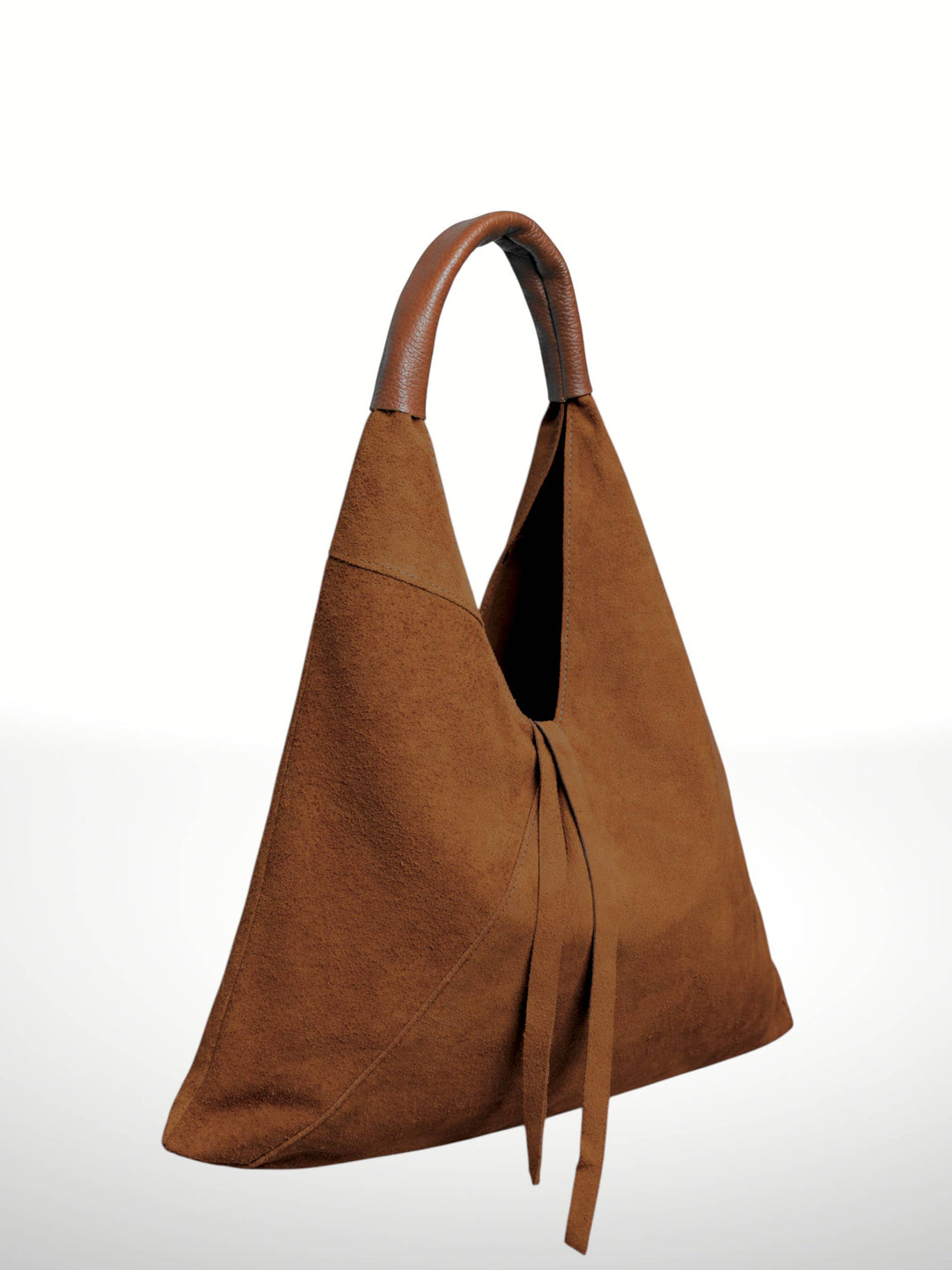 A brown suede hobo-style shoulder bag with a curved top handle and long tie straps, shown on a clean white background.