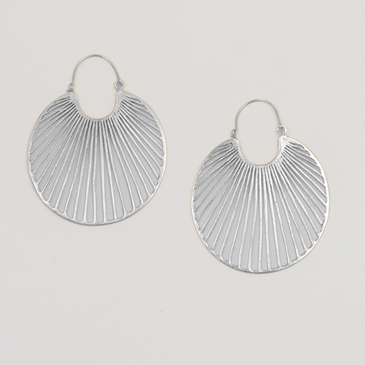Pair of silver hoop earrings on a light gray background